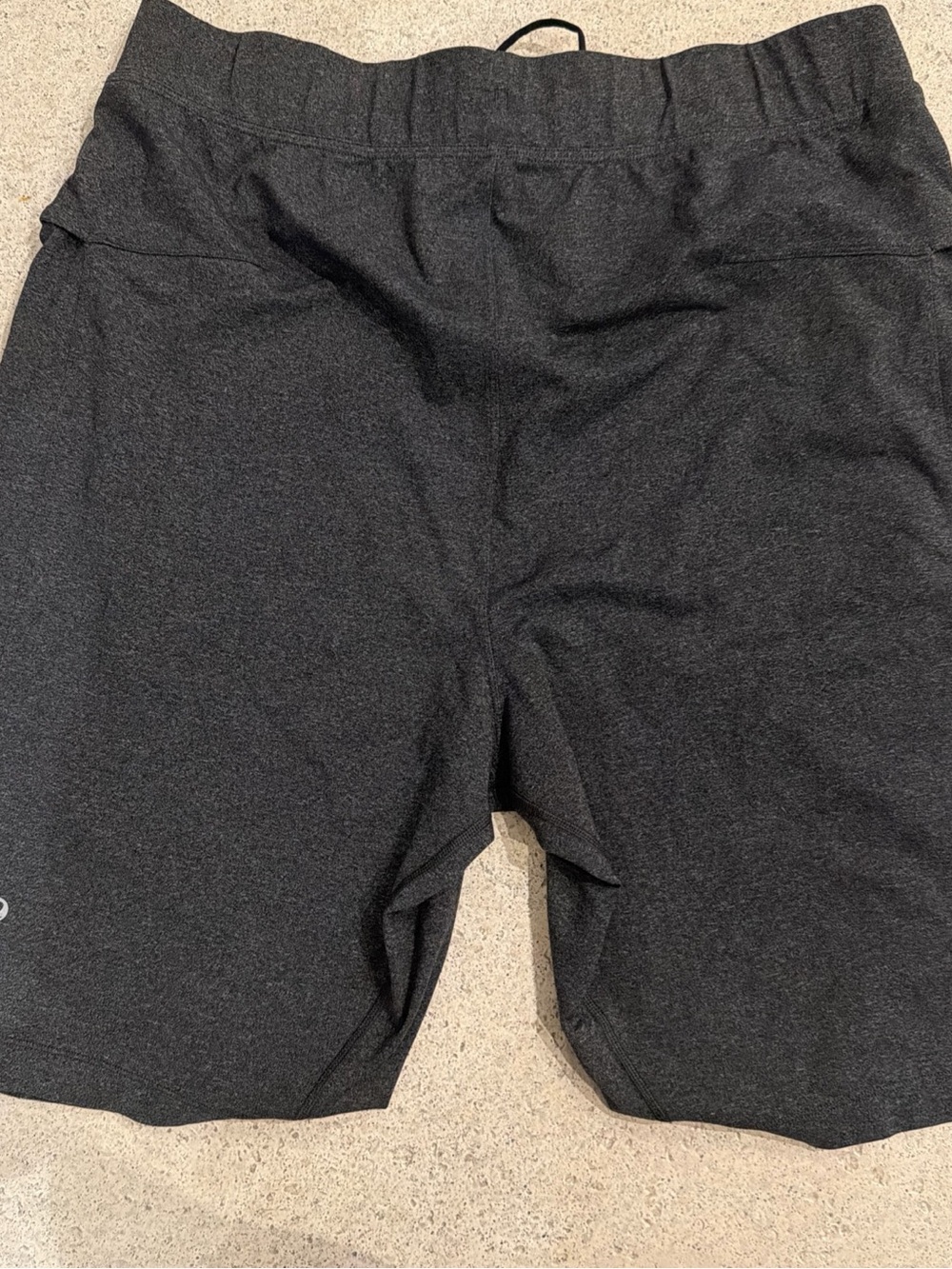 Lululemon men's athletic shorts in a dark gray color with a drawstring waist XL